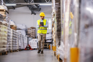 Warehouse worker using tablet